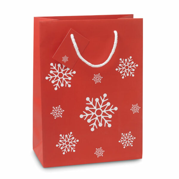 Elegancka torba na prezenty ze wzorem płatków śniegu. Bilecik umieszczony na uchwycie. Rozmiar średni.. Gadżet reklamowy dla firmy.