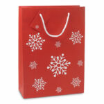 Elegancka torba na prezenty ze wzorem płatków śniegu. Bilecik umieszczony na uchwycie. Rozmiar duży.. Gadżet reklamowy dla firmy.