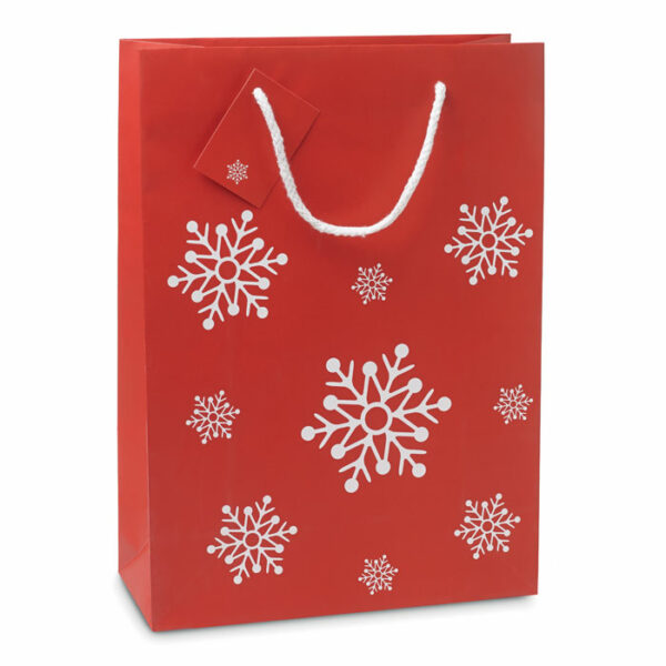 Elegancka torba na prezenty ze wzorem płatków śniegu. Bilecik umieszczony na uchwycie. Rozmiar duży.. Gadżet reklamowy dla firmy.
